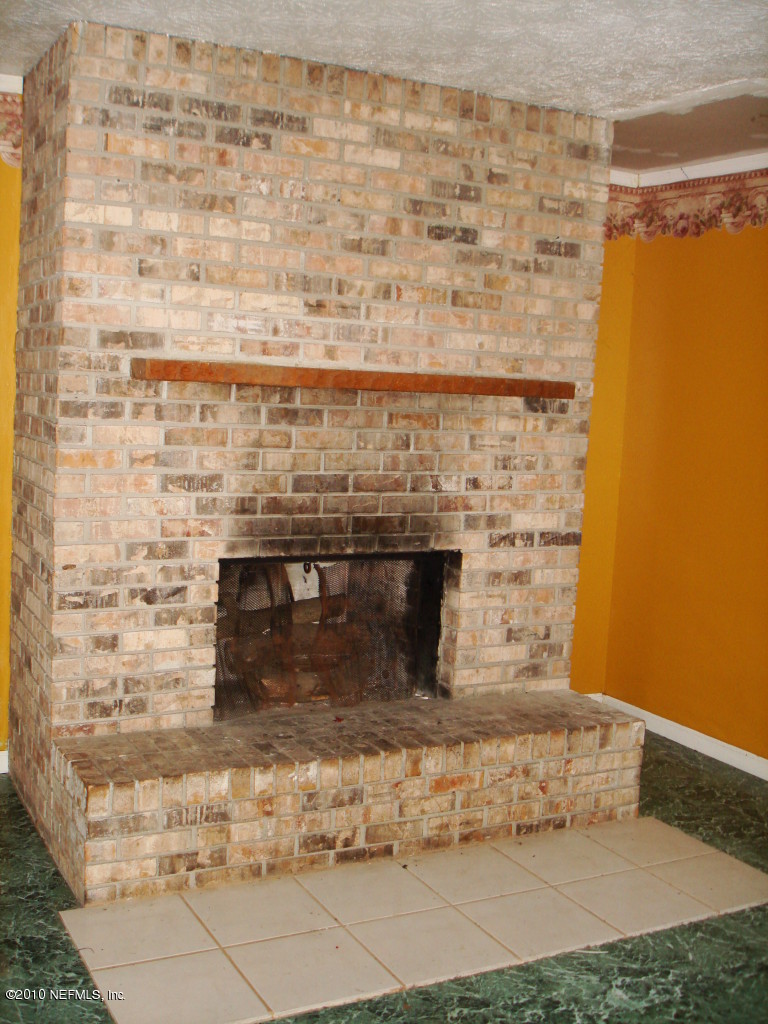 2402 Firestone Road Jacksonville, FL 32210 - Photo 4 of 4 fireplace