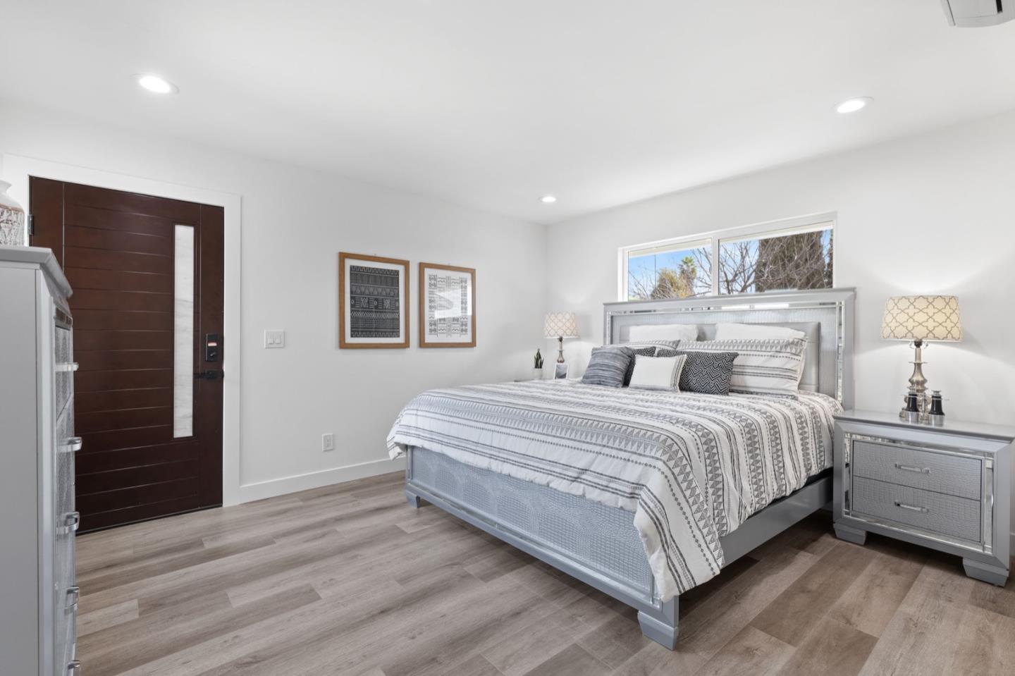 2245 Old Piedmont Road San Jose, CA 95132 - Photo 16 of 39 a spacious bedroom with a bed and a lamp