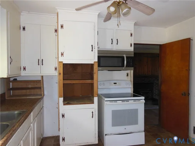 a kitchen with a stove and a microwave