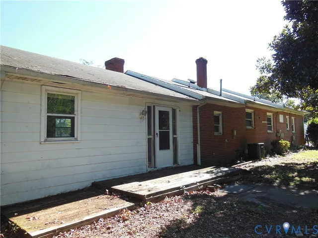 a pathway of a house with a yard