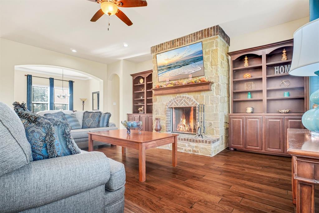 14095 Pecan Lane Forney, TX 75126 - Photo 13 of 34 a living room with furniture and a fireplace