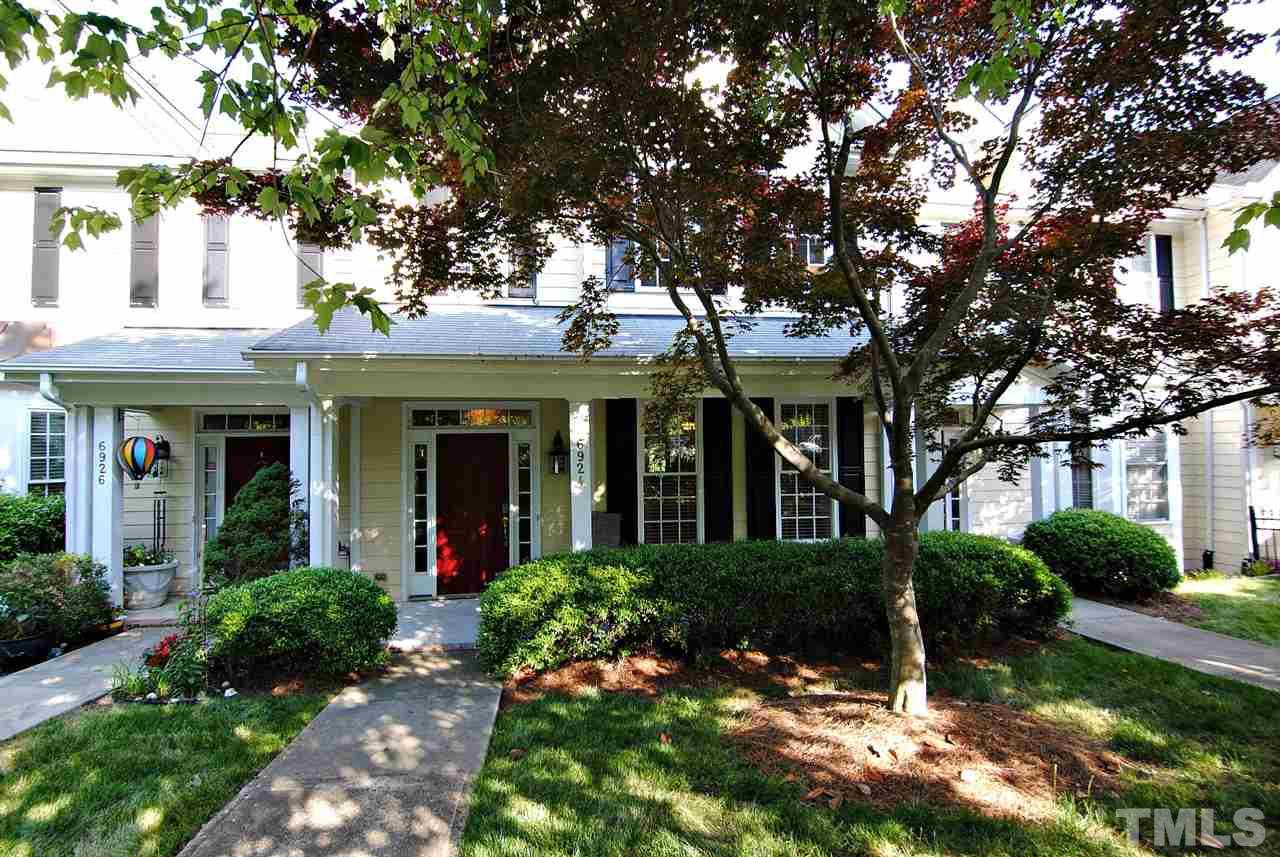 6924 Ray Road Raleigh, NC 27613 - Photo 1 of 22 front view of a brick house with a yard