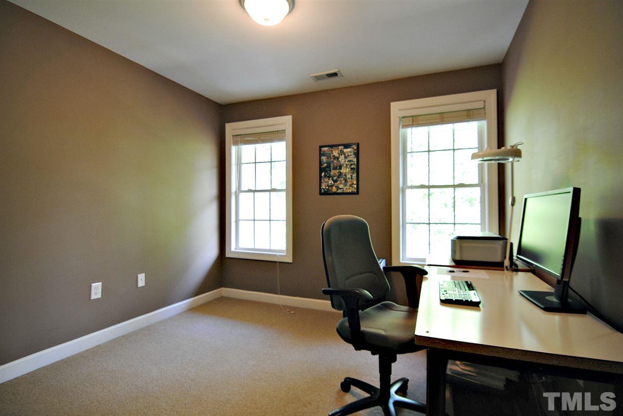 6924 Ray Road Raleigh, NC 27613 - Photo 17 of 22 a view of a workspace with furniture and a window