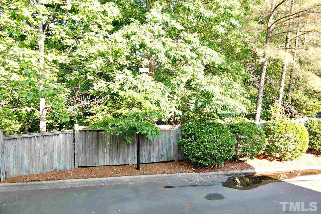 6924 Ray Road Raleigh, NC 27613 - Photo 22 of 22 a backyard of a house with a tree