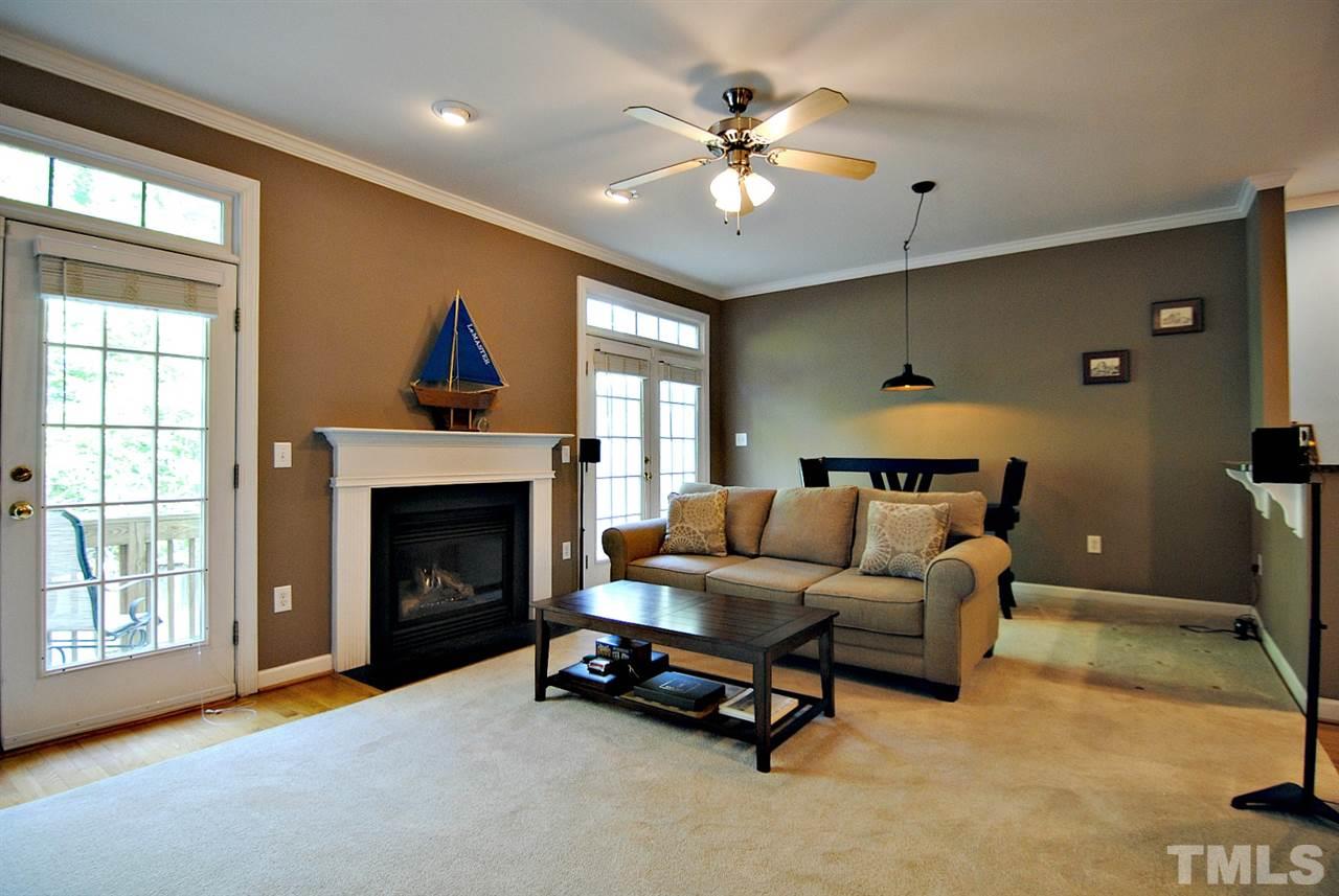 6924 Ray Road Raleigh, NC 27613 - Photo 5 of 22 a living room with furniture and a fireplace