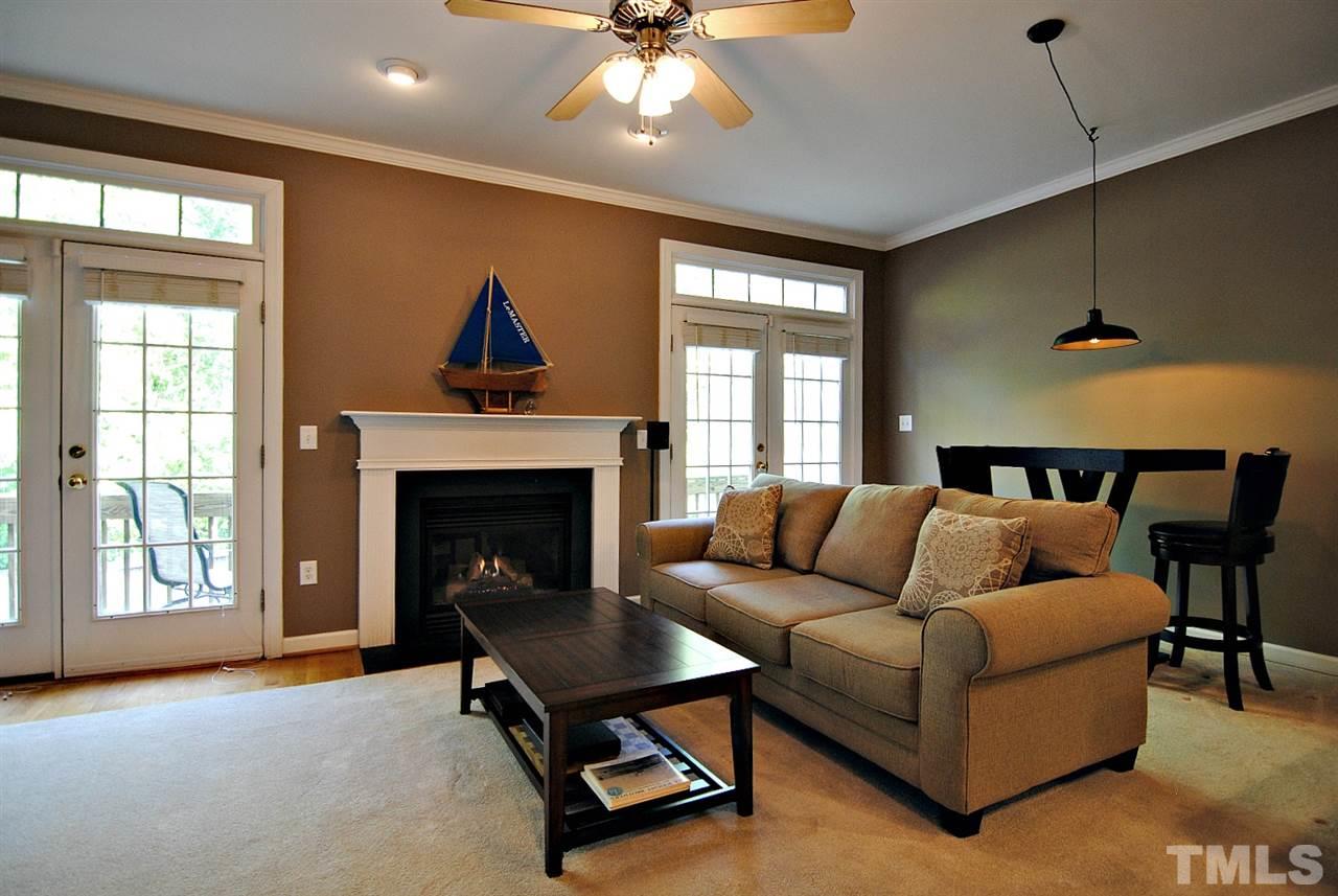 6924 Ray Road Raleigh, NC 27613 - Photo 6 of 22 a living room with furniture and a fireplace