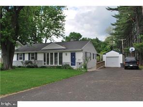 595 West County Line Road Hatboro, PA 19040 - Photo 1 of 11 a view of a house with a yard and large trees