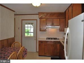 595 West County Line Road Hatboro, PA 19040 - Photo 2 of 11 a kitchen with a refrigerator and a stove