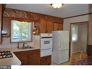 595 West County Line Road Hatboro, PA 19040 - Photo 5 of 11 a kitchen with a refrigerator and a sink