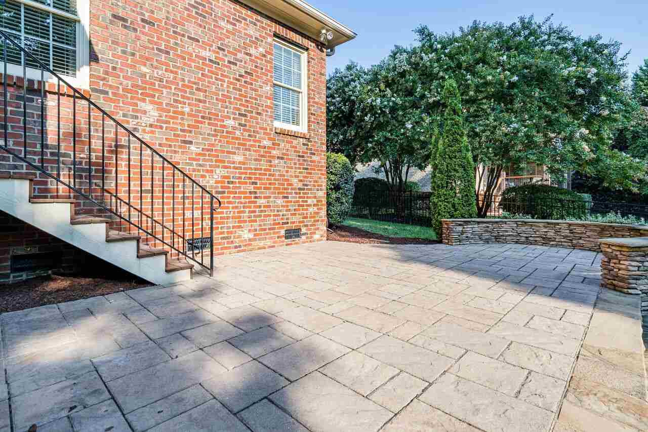 3820 Laurel Hills Road Raleigh, NC 27612 - Photo 27 of 30 From the screened porch, come down and enjoy the patio and huge grassy yard! Patio