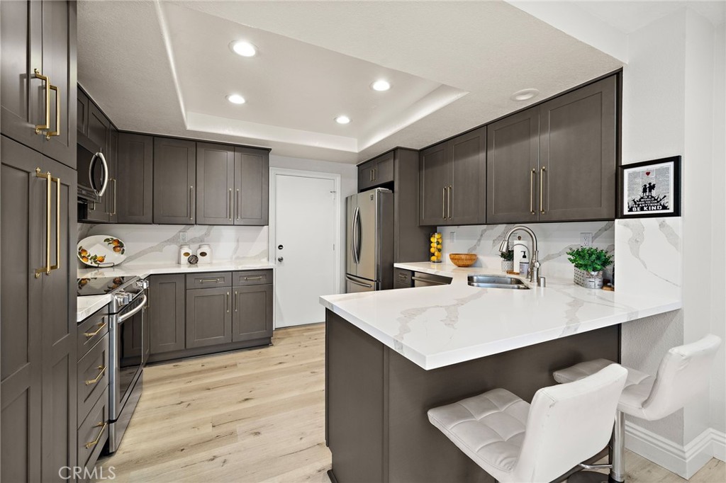18134 Rustic Court Fountain Valley, CA 92708 - Photo 10 of 40 Upgraded Kitchen w/ pantry pullouts.
