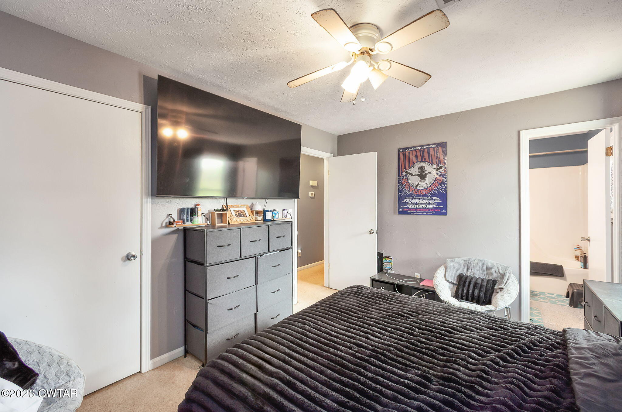 64 Ellendale Place Jackson, TN 38305 - Photo 11 of 19 a bedroom with a bed and a flat screen tv