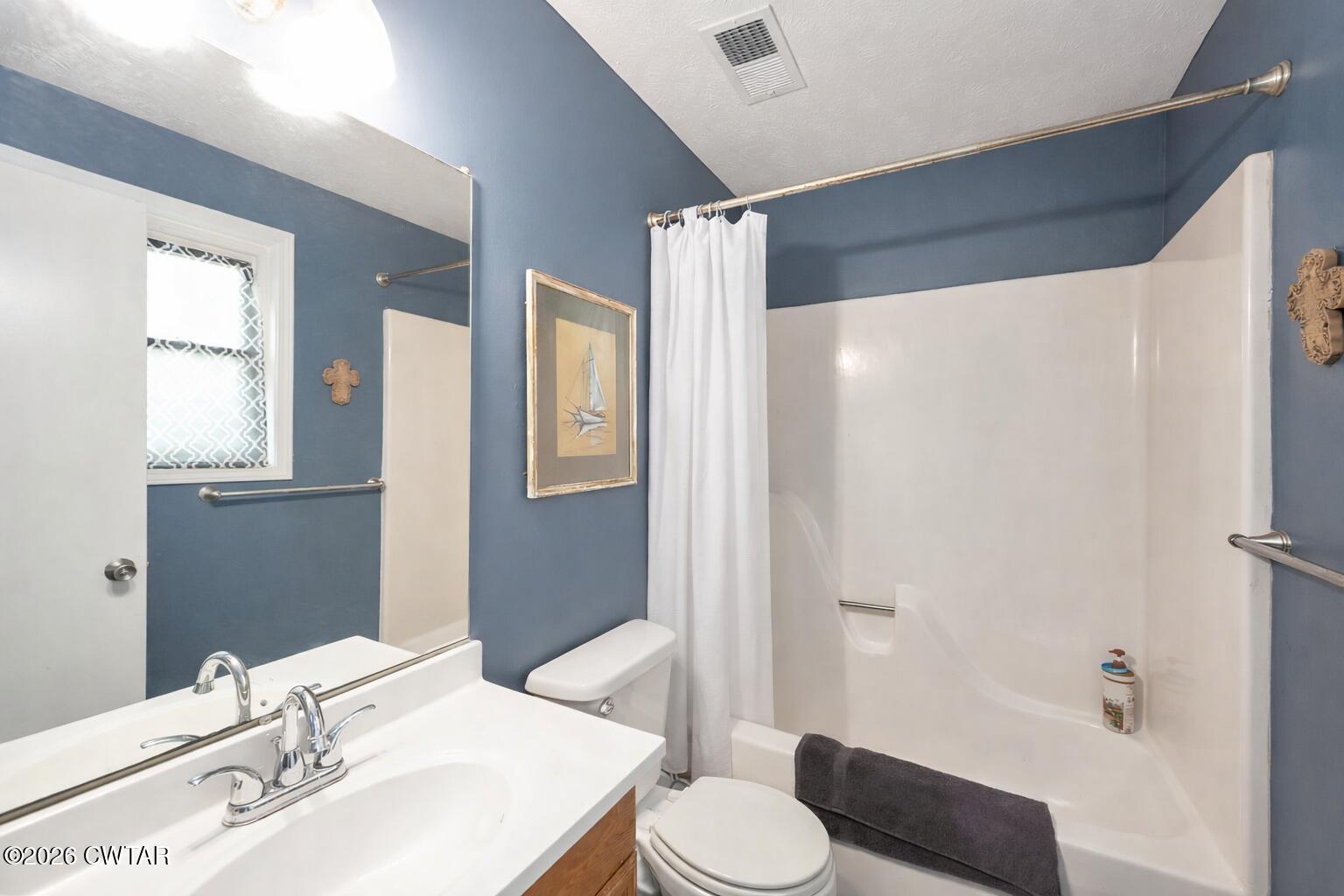 64 Ellendale Place Jackson, TN 38305 - Photo 15 of 19 a bathroom with a sink toilet and shower