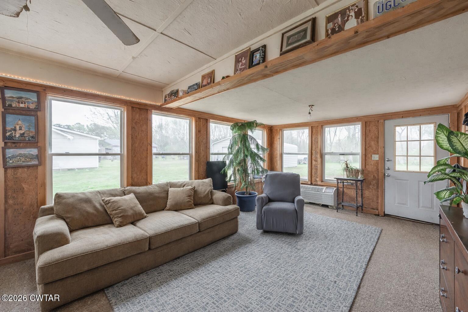 64 Ellendale Place Jackson, TN 38305 - Photo 16 of 19 a living room with furniture and a large window
