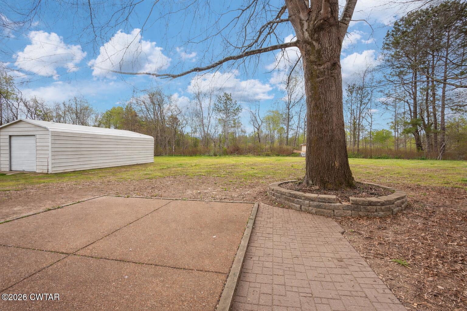 64 Ellendale Place Jackson, TN 38305 - Photo 18 of 19 a view of a yard with entertaining space