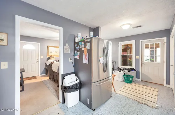 a view of a hallway with living room and furniture