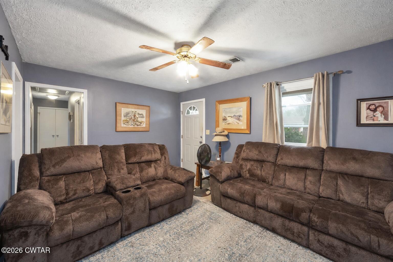 64 Ellendale Place Jackson, TN 38305 - Photo 7 of 19 a living room with furniture and a large mirror