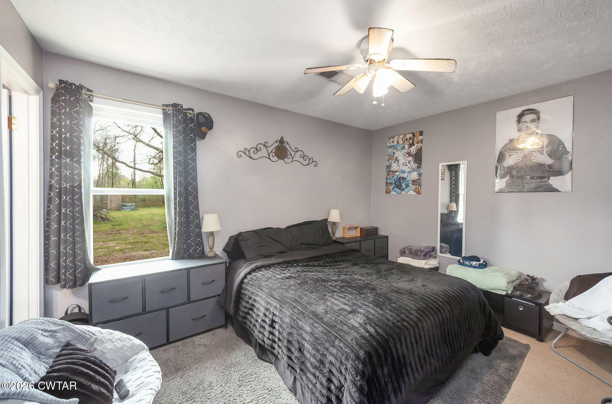 64 Ellendale Place Jackson, TN 38305 - Photo 10 of 19 a bedroom with a large bed and a window