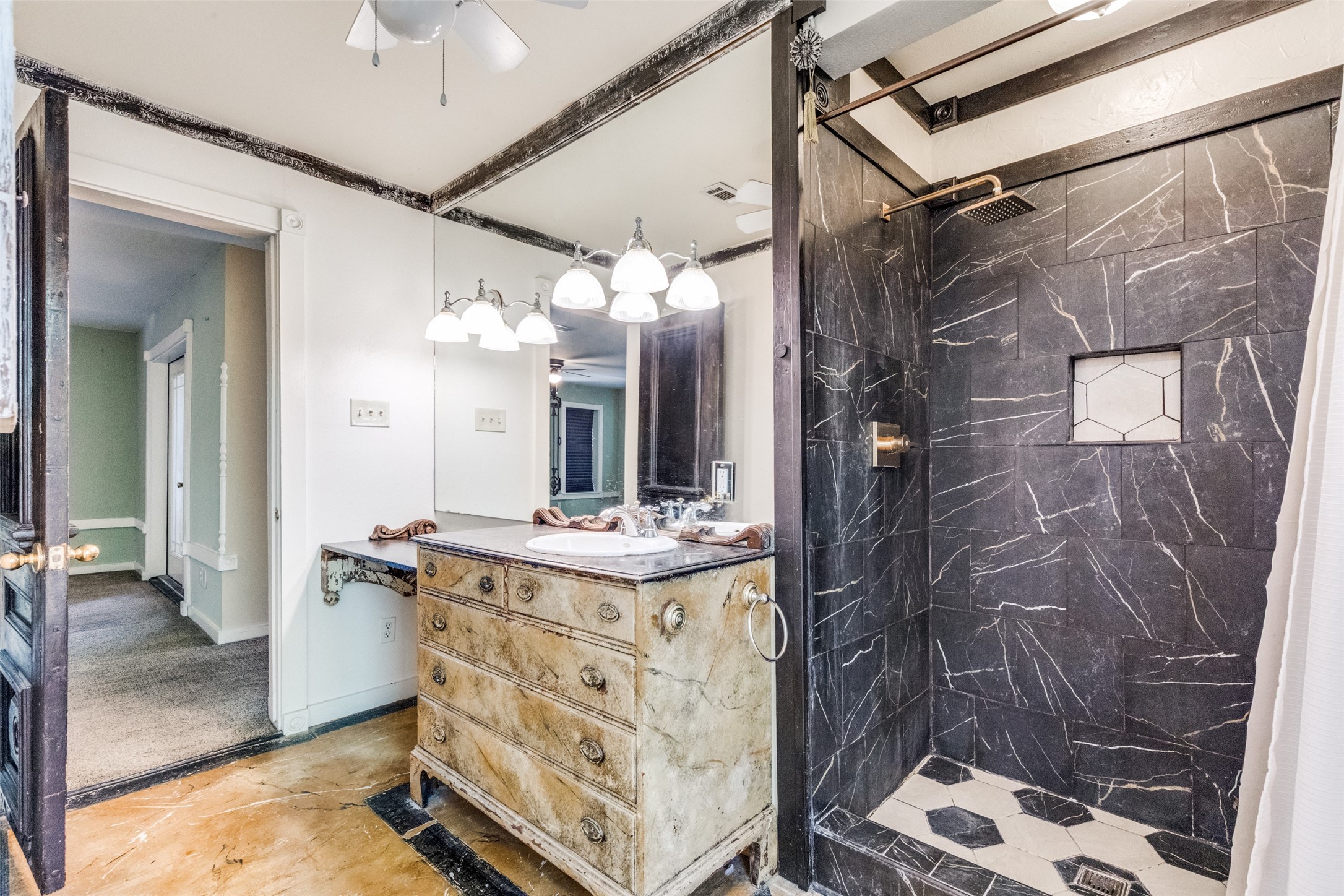 1005 Center Circle Salado, TX 76571 - Photo 20 of 25 The full bath U/S features a hand-painted vanity sink and a recently upgraded shower with black and whit tile