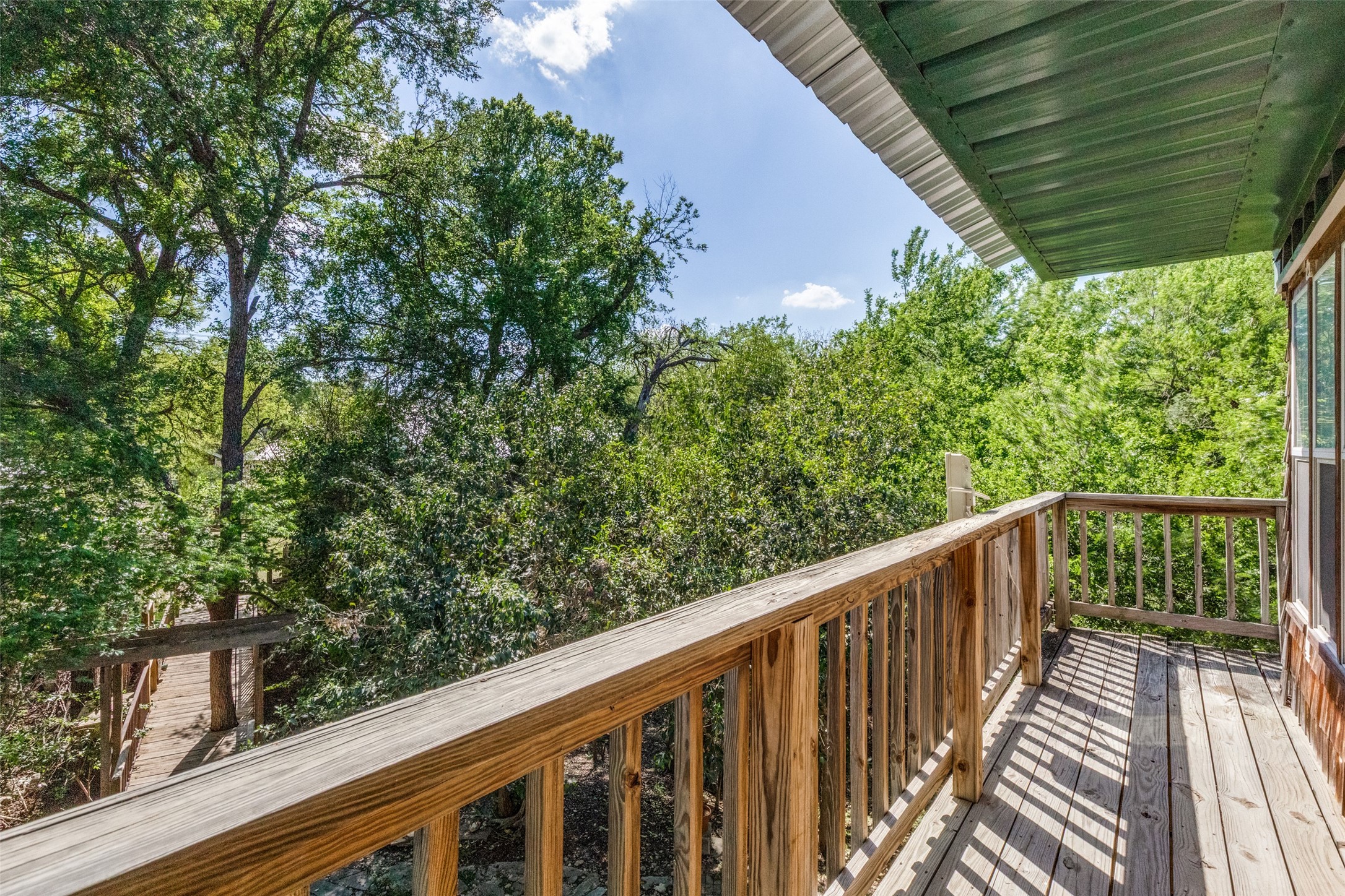 1005 Center Circle Salado, TX 76571 - Photo 23 of 25 Take in the view of the dry creek bed and tree surrounding the property from the wrap around balcony.