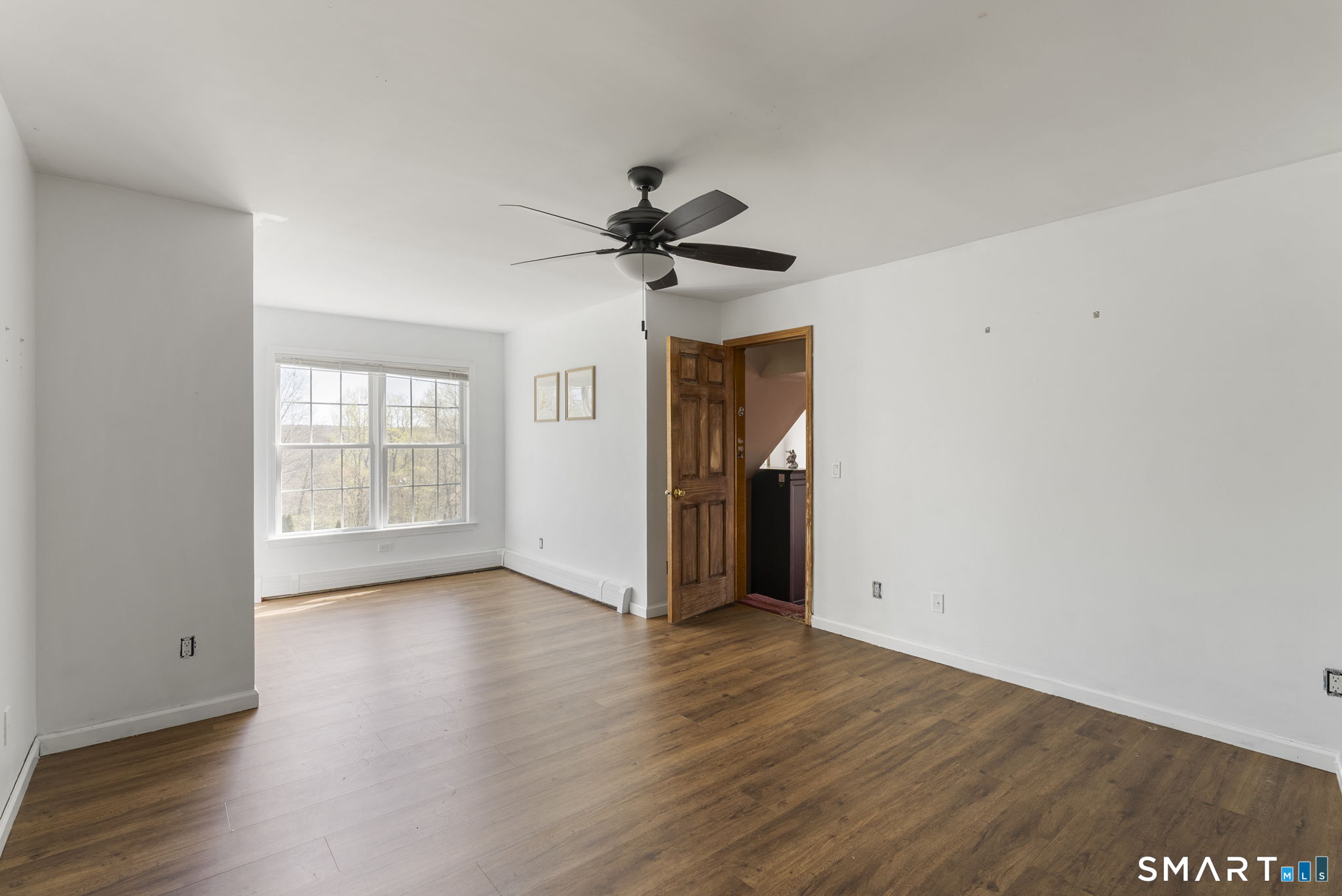 341 High Street Extension Thomaston, CT 06787 - Photo 23 of 39 an empty room with wooden floor and ceiling fan