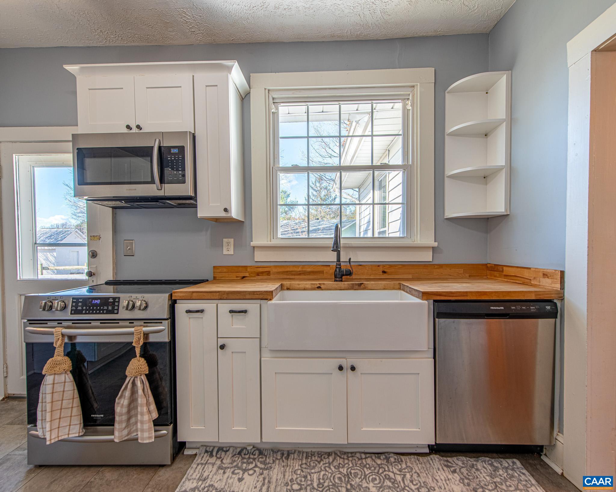 22 Quarter Lane Buckingham, VA 23921 - Photo 12 of 36 a kitchen with stainless steel appliances granite countertop a stove a sink and a microwave