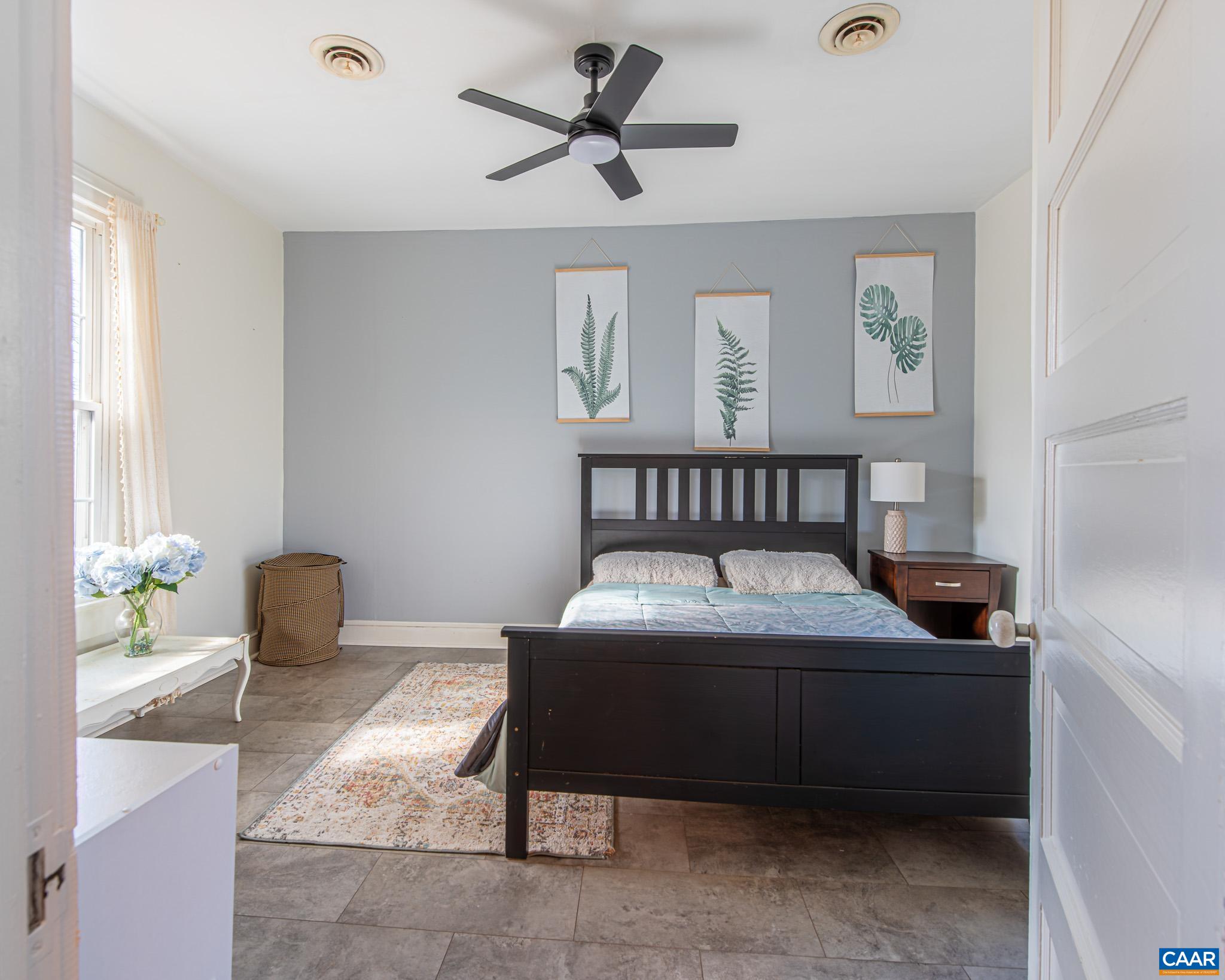 22 Quarter Lane Buckingham, VA 23921 - Photo 15 of 36 a bedroom with a bed and a table