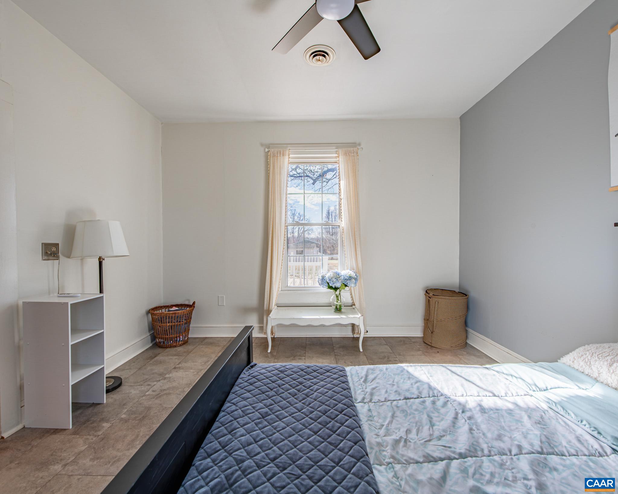 22 Quarter Lane Buckingham, VA 23921 - Photo 17 of 36 a bedroom with a bed and a window