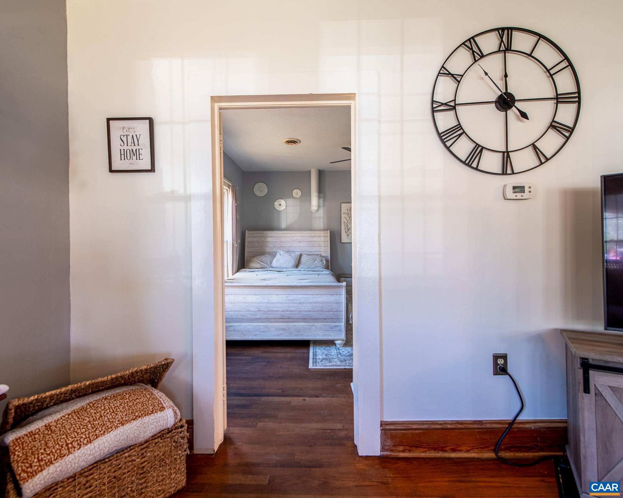 22 Quarter Lane Buckingham, VA 23921 - Photo 18 of 36 a bedroom with a bed and wooden floor