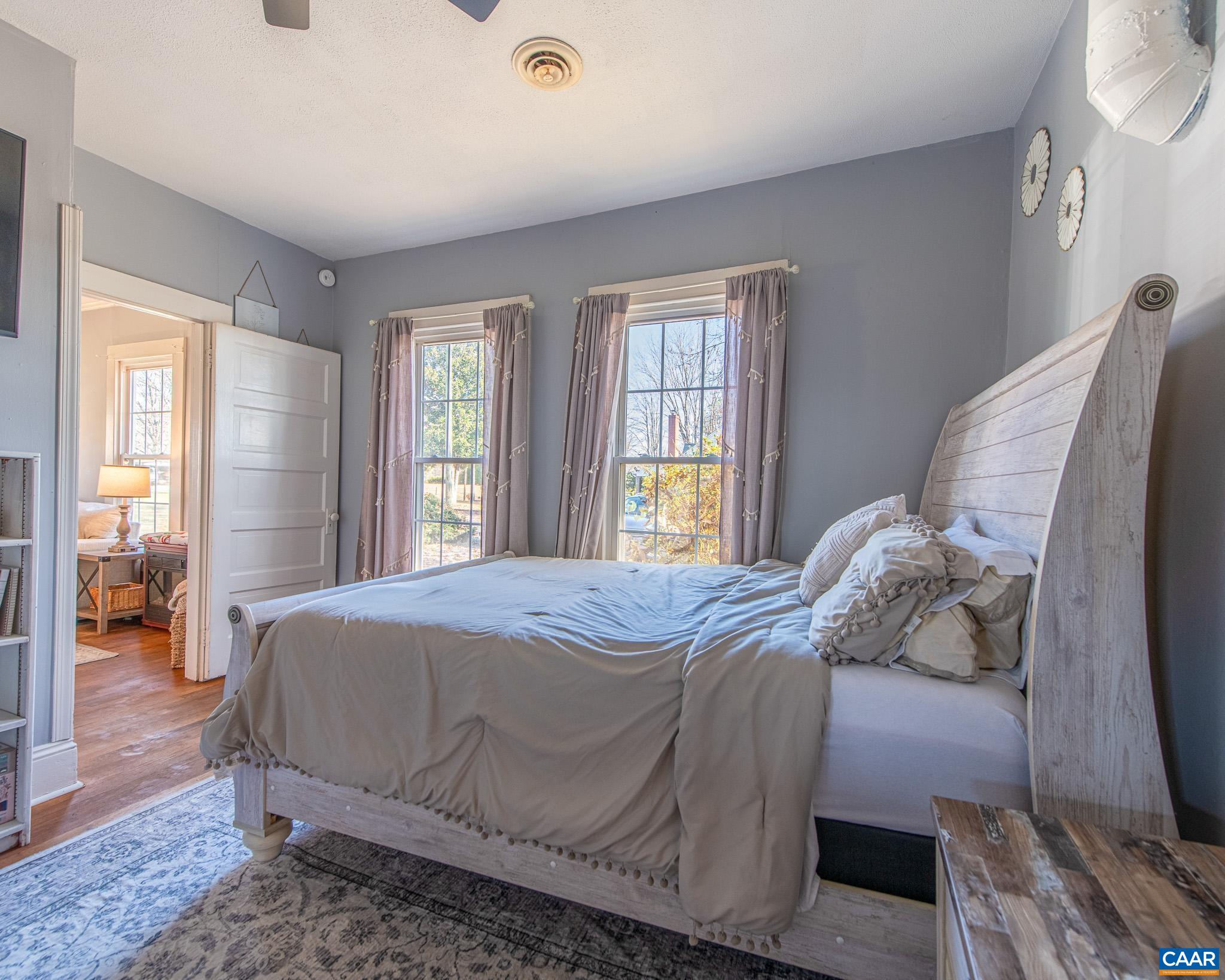 22 Quarter Lane Buckingham, VA 23921 - Photo 20 of 36 a bedroom with a bed and wooden floor