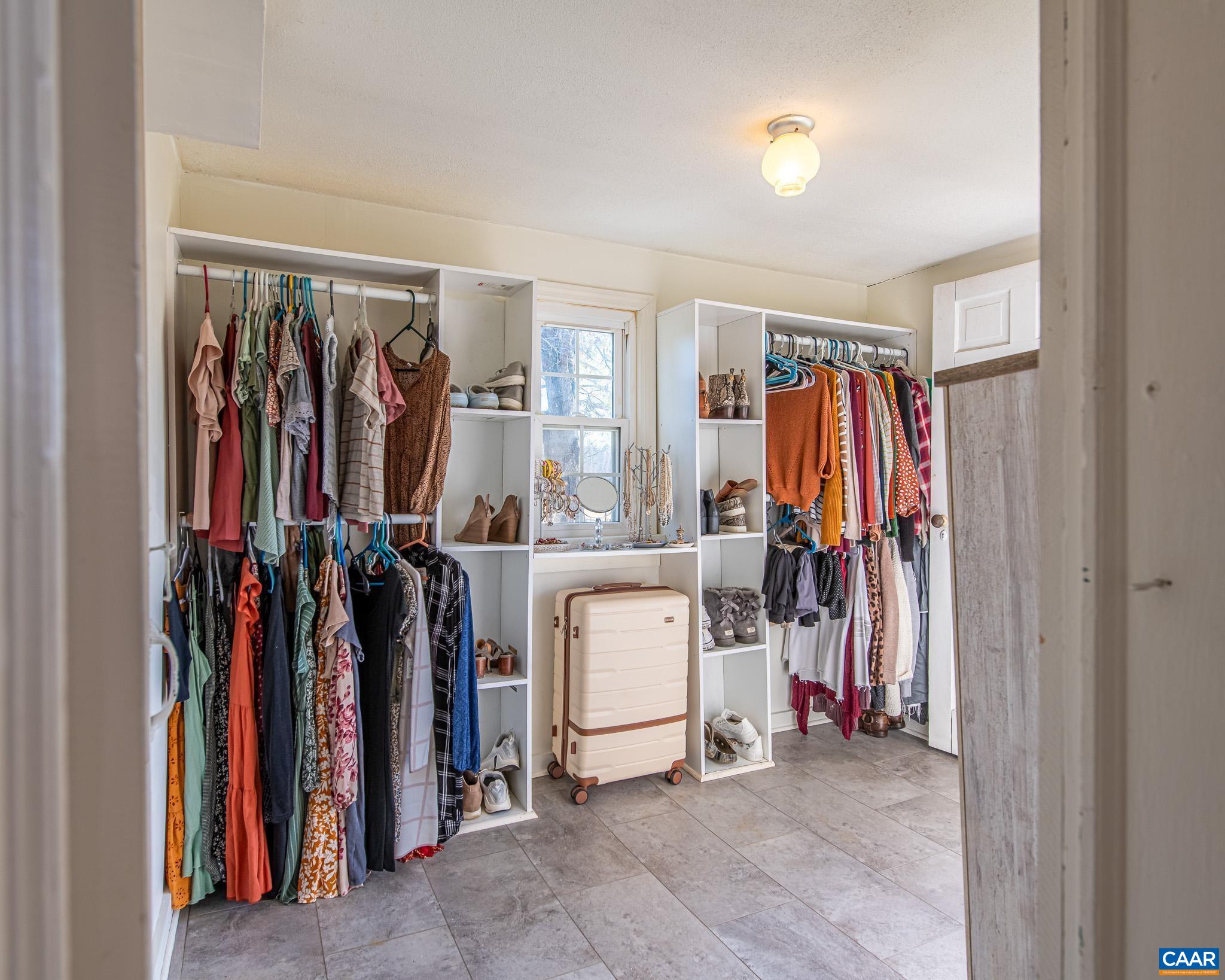 22 Quarter Lane Buckingham, VA 23921 - Photo 22 of 36 a view of walk in closet with clothes