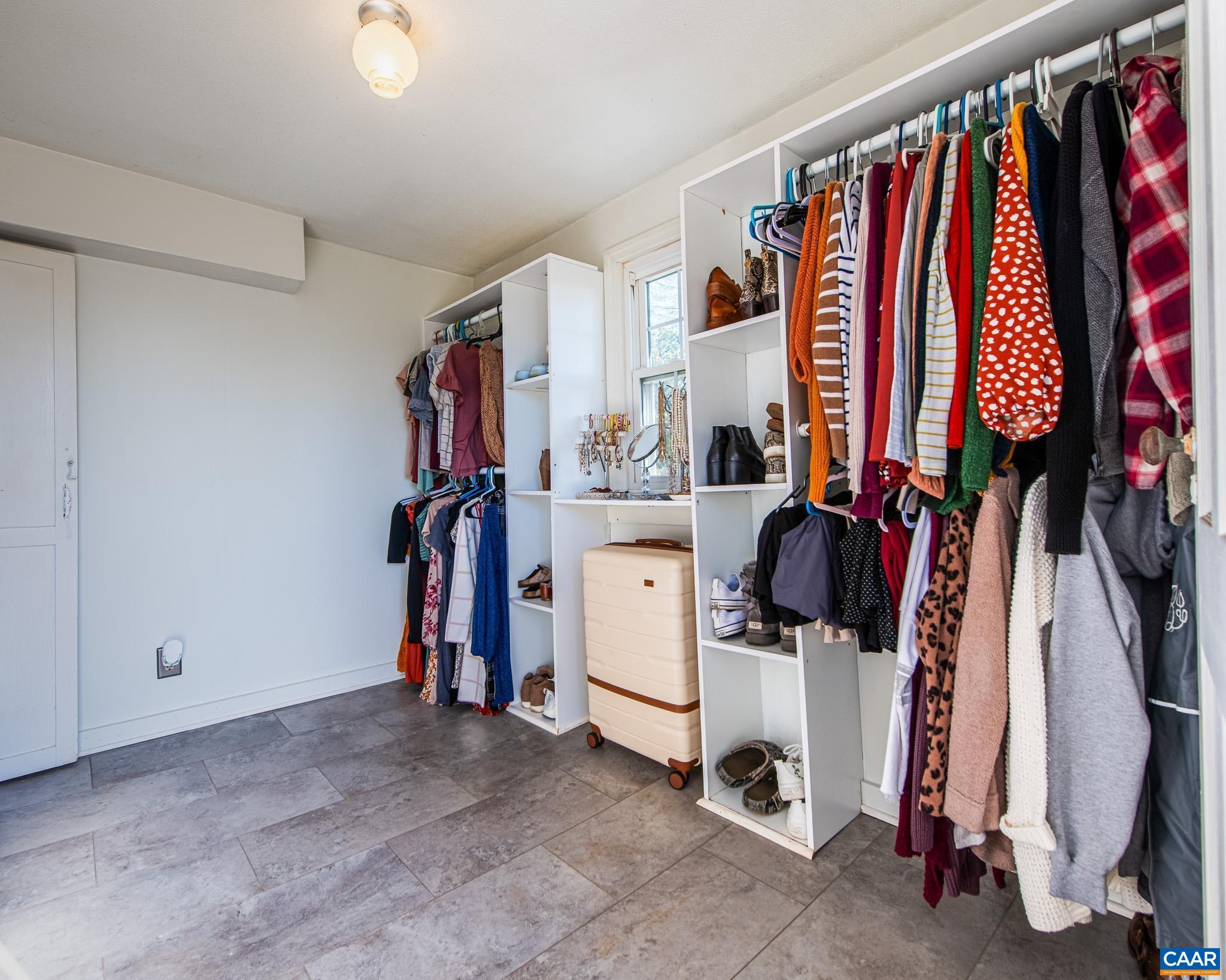 22 Quarter Lane Buckingham, VA 23921 - Photo 23 of 36 a view of walk in closet with clothes and shoes