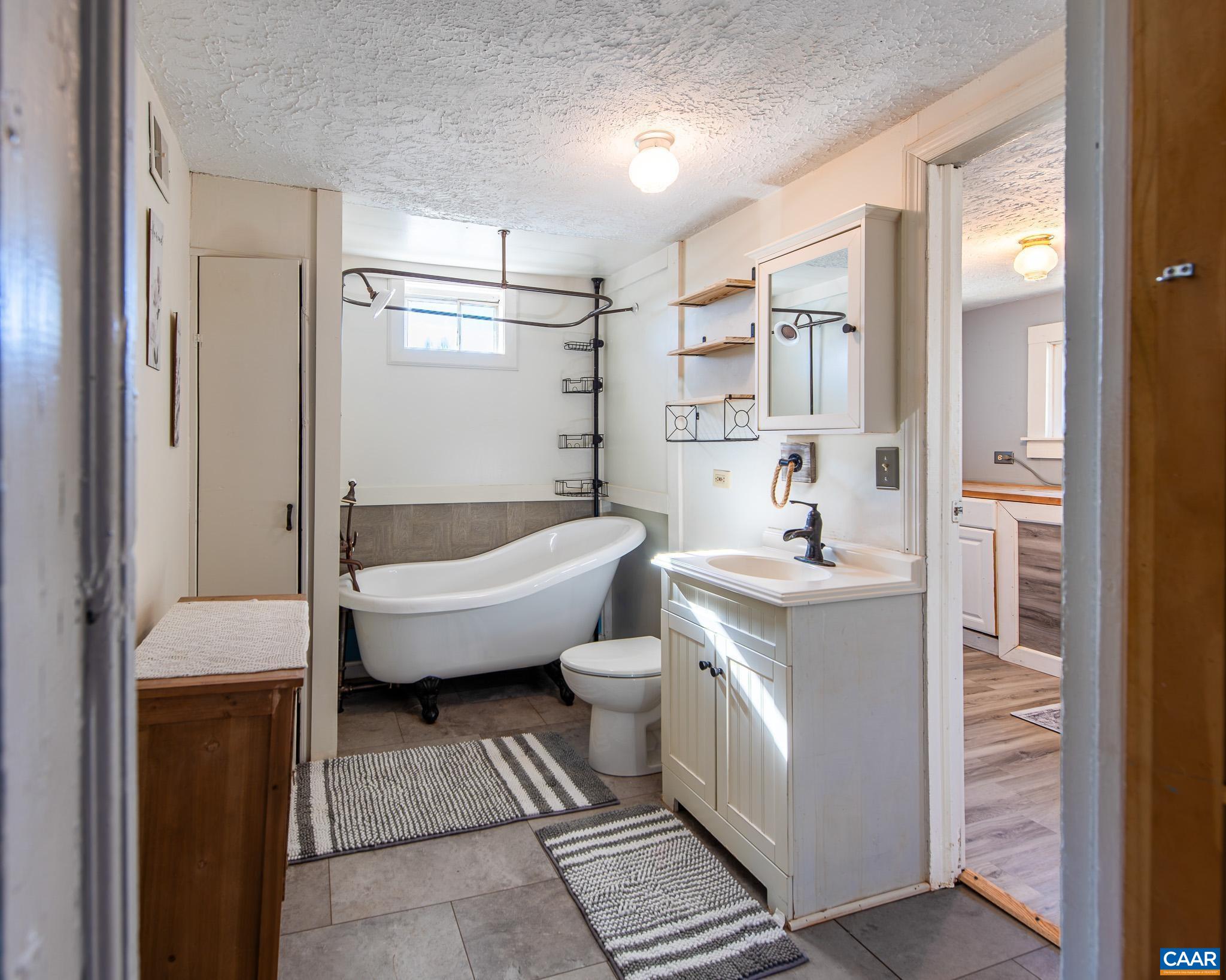 22 Quarter Lane Buckingham, VA 23921 - Photo 24 of 36 a spacious bathroom with a bathtub sink and toilet