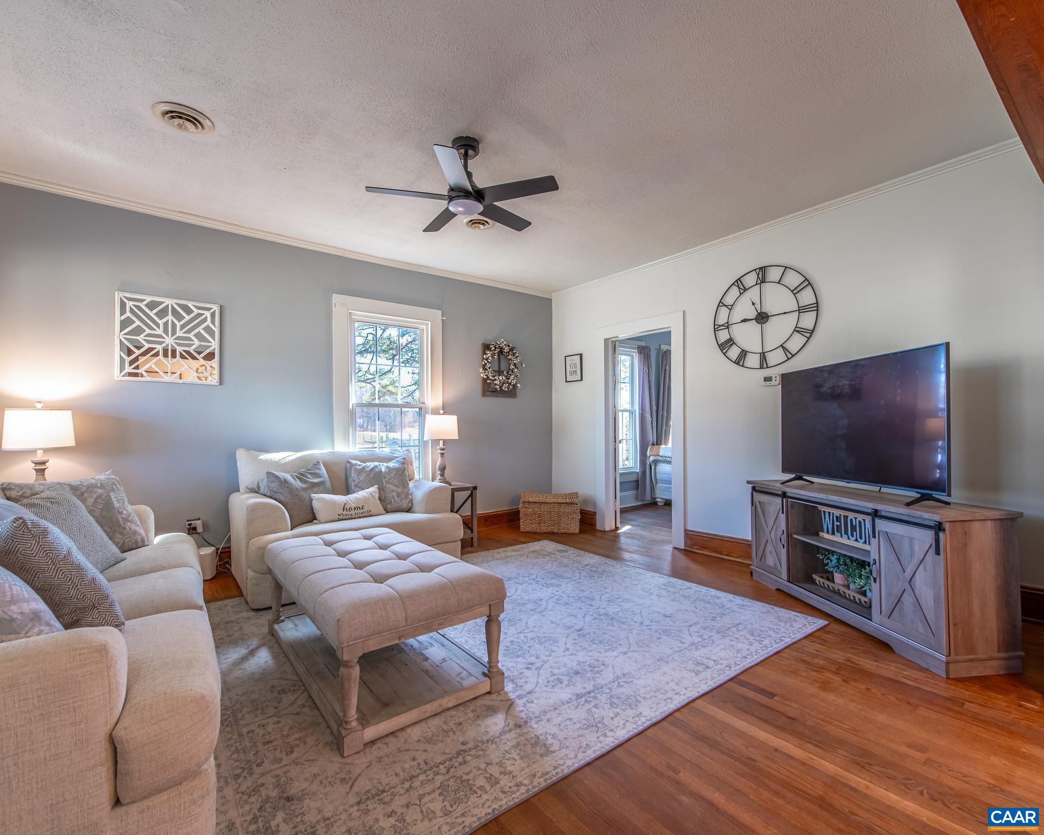 22 Quarter Lane Buckingham, VA 23921 - Photo 6 of 36 a living room with furniture and a flat screen tv