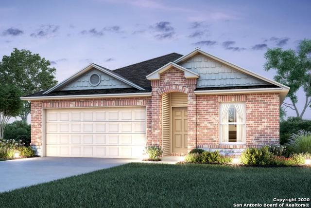 7323 Percheron Way Elmendorf, TX 78112 - Photo 1 of 1 a front view of a house with a yard and garage