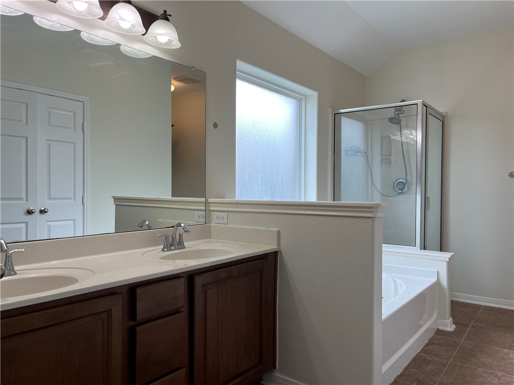 1406 Sacramento Street Portland, TX 78374 - Photo 11 of 35 a bathroom with a sink a light fixture and a mirror