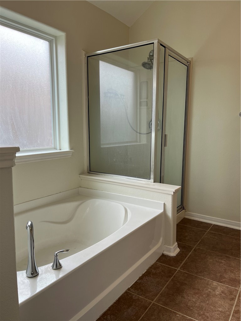 1406 Sacramento Street Portland, TX 78374 - Photo 12 of 35 a bathroom with a bathtub and a shower