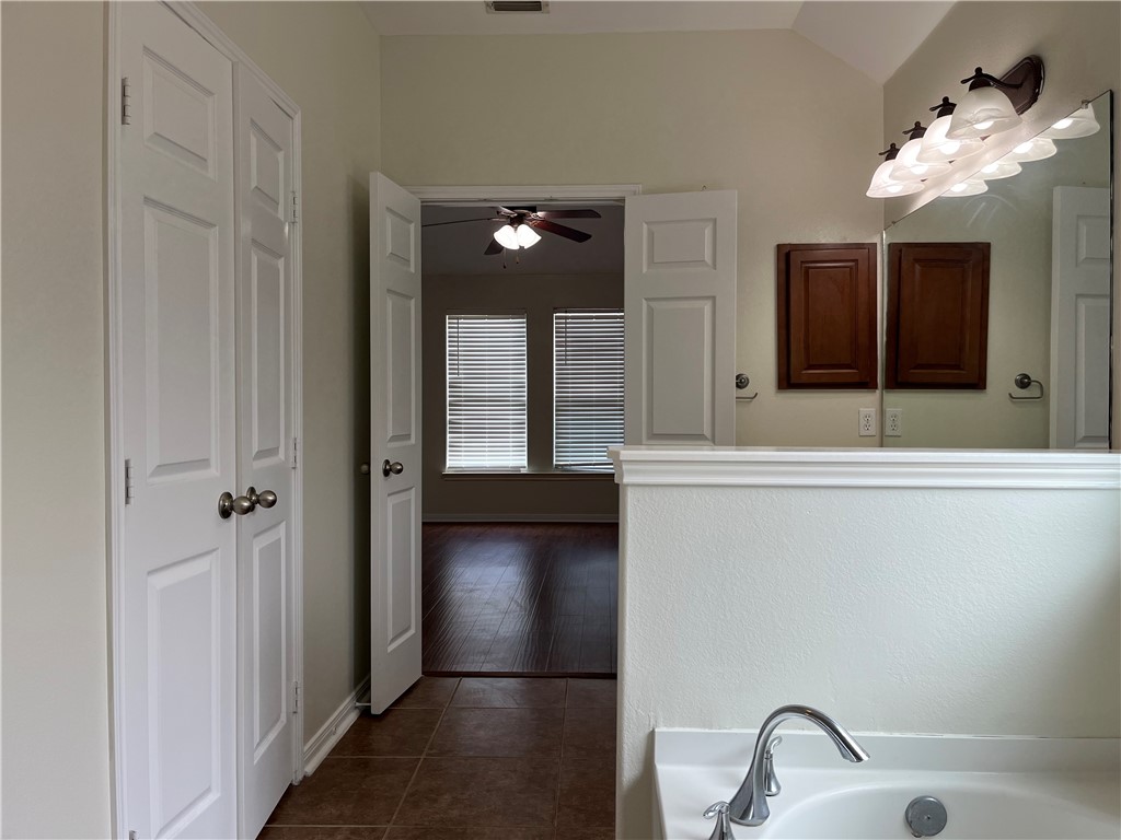 1406 Sacramento Street Portland, TX 78374 - Photo 15 of 35 a bathroom with a sink and a mirror