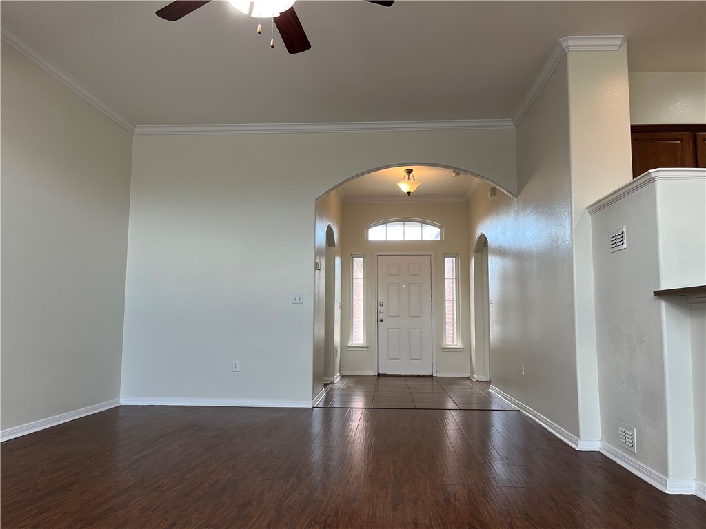 1406 Sacramento Street Portland, TX 78374 - Photo 24 of 35 an empty room with wooden floor and windows