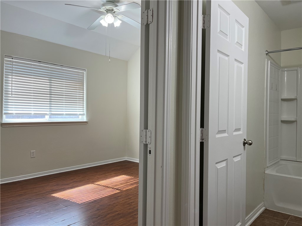 1406 Sacramento Street Portland, TX 78374 - Photo 25 of 35 a view of an empty room with wooden floor and a window