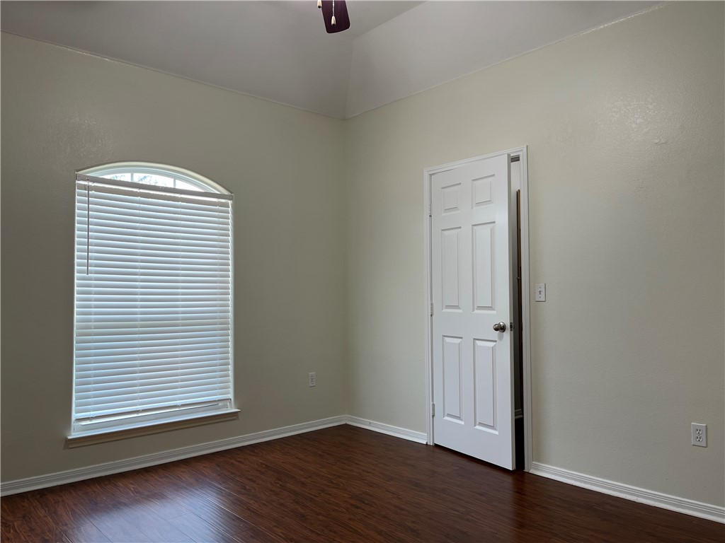 1406 Sacramento Street Portland, TX 78374 - Photo 29 of 35 an empty room with wooden floor and a window