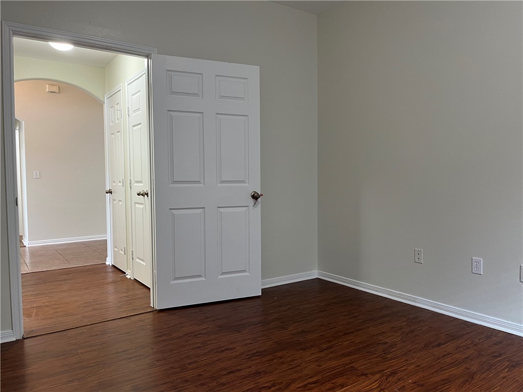 1406 Sacramento Street Portland, TX 78374 - Photo 6 of 35 a view of an empty room with wooden floor