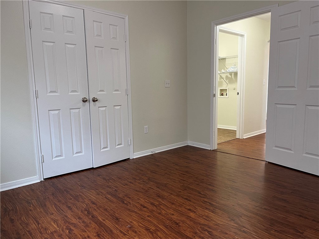 1406 Sacramento Street Portland, TX 78374 - Photo 7 of 35 an empty room with wooden floor