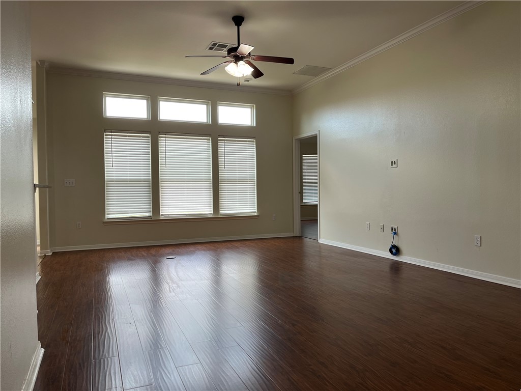 1406 Sacramento Street Portland, TX 78374 - Photo 8 of 35 a view of an empty room with wooden floor and a window