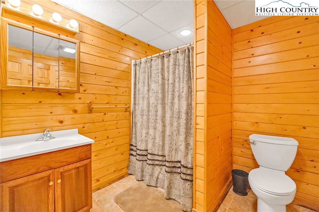 637 River Country Road Piney Creek, NC 28663 - Photo 22 of 49 a bathroom with a toilet sink and shower