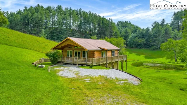 a view of a house with a big yard