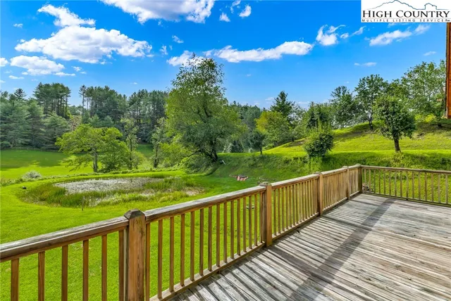a view of a deck with sunset view