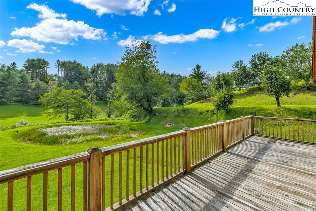 637 River Country Road Piney Creek, NC 28663 - Photo 25 of 49 a view of a deck with sunset view
