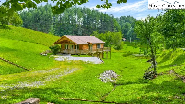 a aerial view of a house with big yard