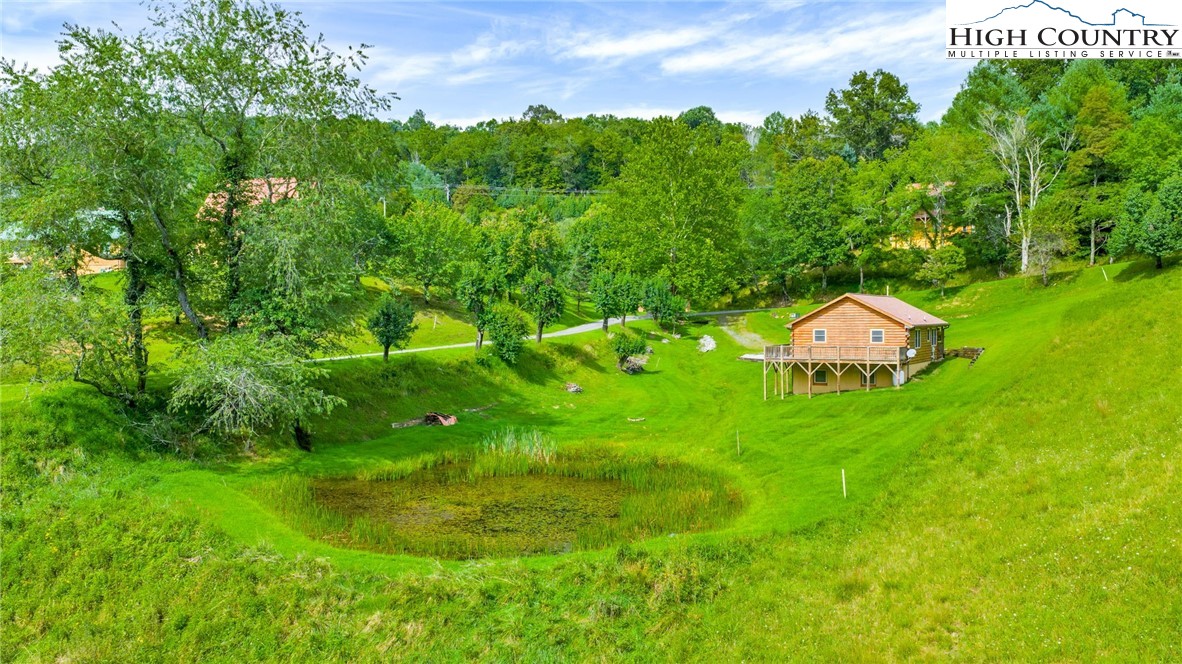 637 River Country Road Piney Creek, NC 28663 - Photo 31 of 49 a backyard of a house with lots of green space